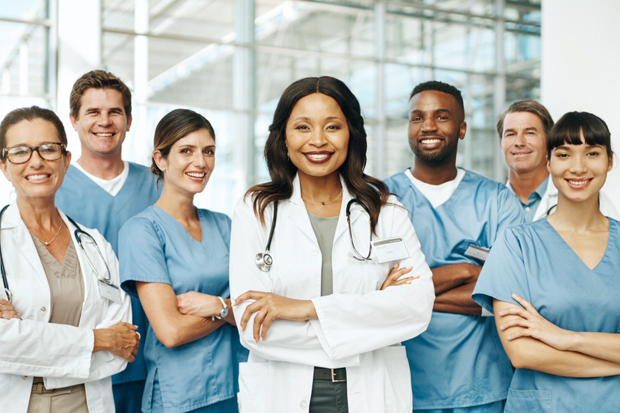 Medical professionals confidently posing with arms crossed.